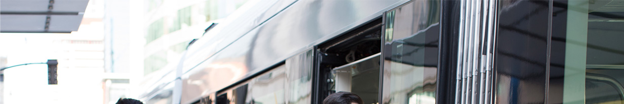 An image of a group getting onto a streetcar. A headline reads: Meetings Thrive Off Innovation.