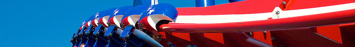 People riding a roller coaster at Worlds Of Fun - a tagline reads: Keep The Momentum Going