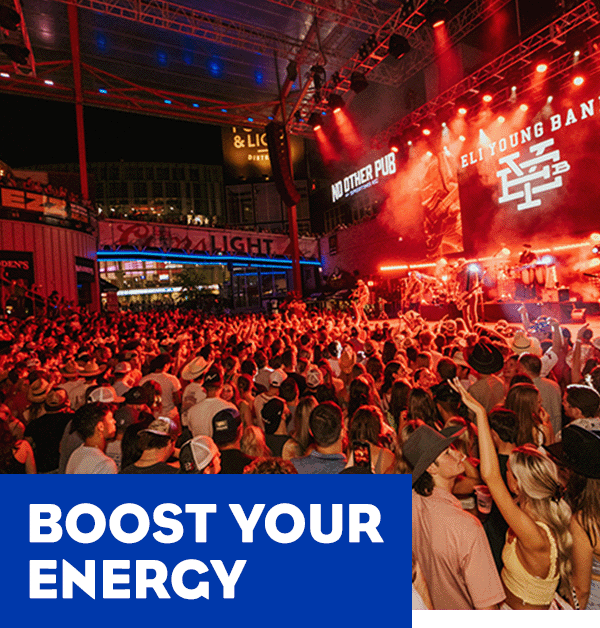 A crowd of people at the Kansas City Power&Light District. A headline reads: Boost Your Energy.