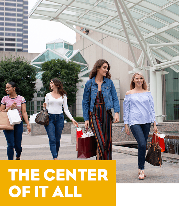 A group of women on a shopping trip - the tagline reads The Center of it All